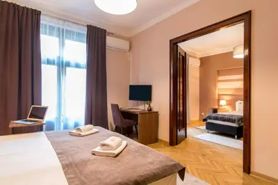 a hotel room with a bed and a mirror at Apartments Top Central 3 in Belgrade
