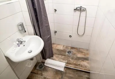 a bathroom with a sink and a shower at Apartments Top Central 3 in Belgrade