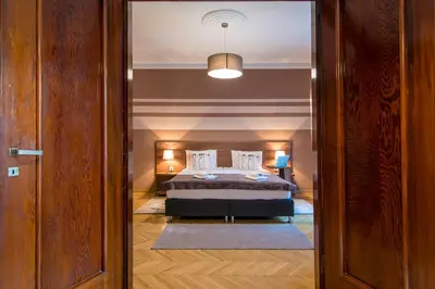 a bedroom with a bed and a glass door at Apartments Top Central 3 in Belgrade