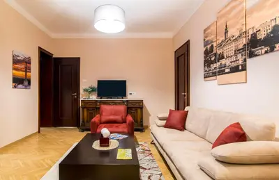 a living room with a couch and a tv at Apartments Top Central 3 in Belgrade
