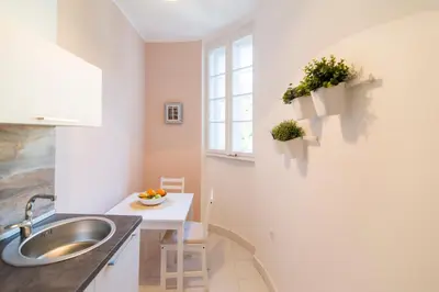 a kitchen with a sink and a window at Apartments Top Central 3 in Belgrade