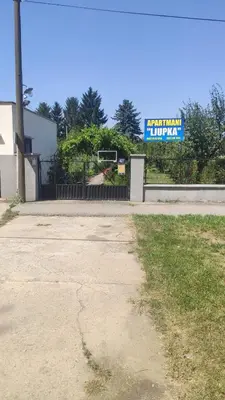 an empty parking lot in front of a building at Apartment Ljupka in Pančevo
