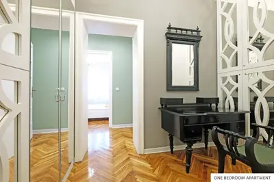 a bathroom with a black sink and a mirror at Downtown Belgrade Apartments in Belgrade