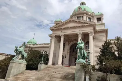 a building with statues in front of it at Habitat Hostel in Belgrade