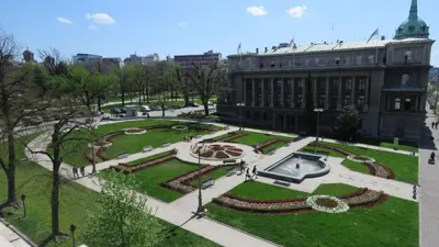 a view of a park in front of a building at Habitat Hostel in Belgrade