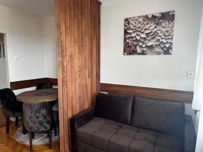 a living room with a couch and a table at Apartment 36 in Belgrade