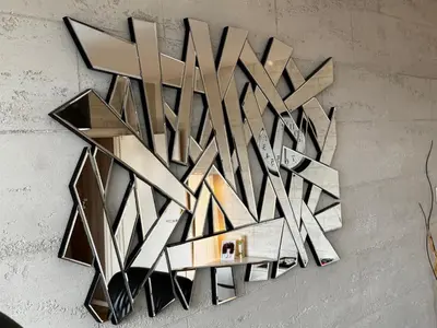 a large metal wall art hanging on a wall at Apartment 36 in Belgrade