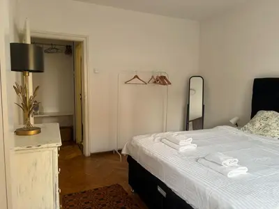 a bedroom with a bed with two towels on it at Star apartment in Belgrade