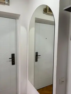 a mirror in front of a white door at Star apartment in Belgrade