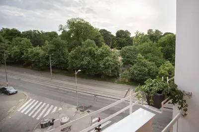 a view of a street with a car on the road at City Side Up Exclusive in Belgrade