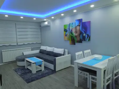 a living room with a couch and a table at Danube Blue in Belgrade