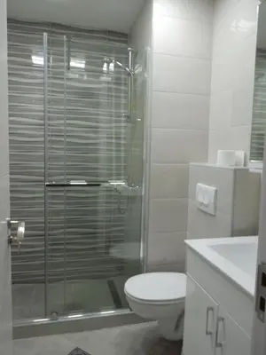 a bathroom with a toilet and a glass shower at Danube Blue in Belgrade