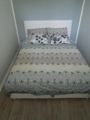a bed in a room with two pillows on it at Danube Blue in Belgrade