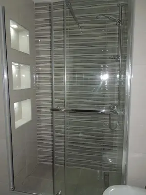 a shower with a glass door in a bathroom at Danube Blue in Belgrade