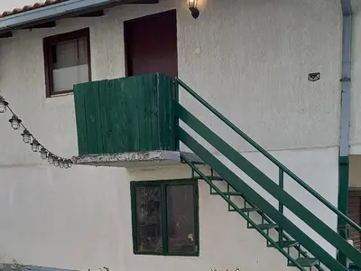 a green staircase on the side of a building at Julijana in Belgrade