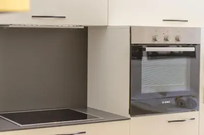 a kitchen with an oven and a stove top at Sava Smart Apartment in Belgrade