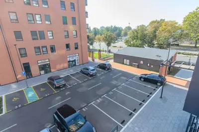 an aerial view of a parking lot with parked cars at Sava Smart Apartment in Belgrade