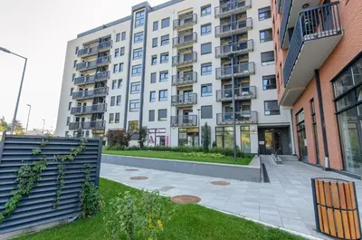 an apartment building with a courtyard in front of it at Sava Smart Apartment in Belgrade