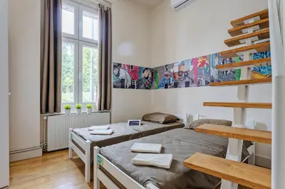 a bedroom with two beds in a room at Booking BnB in Belgrade