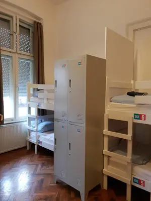 a room with two bunk beds and a bed at Booking BnB in Belgrade