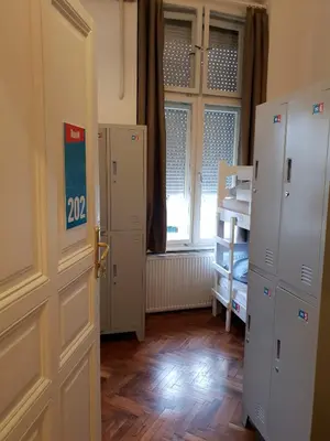 a small room with a door and a window at Booking BnB in Belgrade