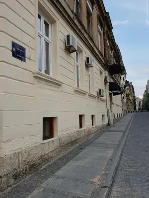 an empty street next to a building at Booking En Suite in Belgrade