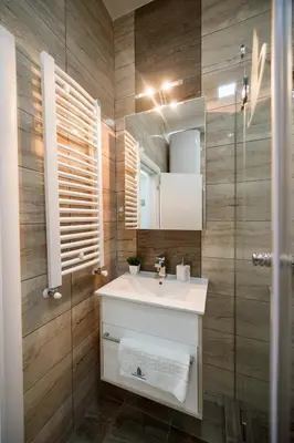 a bathroom with a sink and a mirror at CENTAR Lux in Arandjelovac