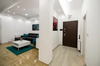 a living room with a couch and a table at CENTAR Lux in Arandjelovac