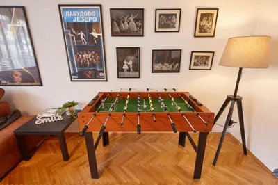 a foosball table in a living room with a lamp at Take 5 in Belgrade