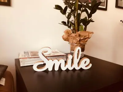 a table with a smile sign on top of it at Take 5 in Belgrade