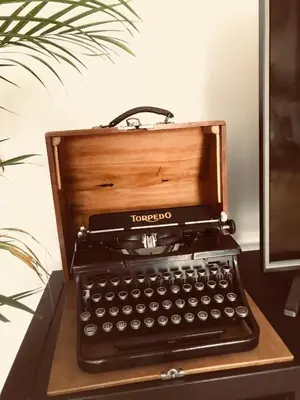 an old typewriter sitting on top of a desk at Take 5 in Belgrade