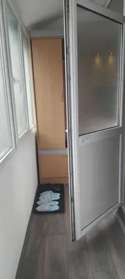 a small room with a door and a mattress on the floor at Cute little apartment in Belgrade