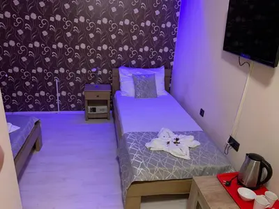 a small room with a bed and a wall at Apartmani CENTAR- Smederevo in Smederevo