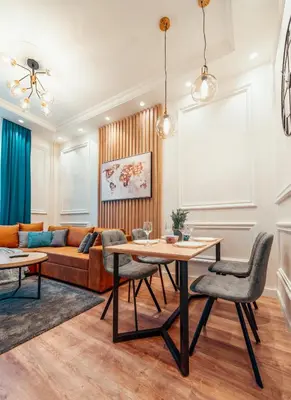a living room with a table and chairs and a couch at Miha Luxury Apartment in Belgrade