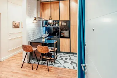 a kitchen with a table and two chairs at Miha Luxury Apartment in Belgrade
