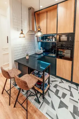 a kitchen with a table and two chairs at Miha Luxury Apartment in Belgrade
