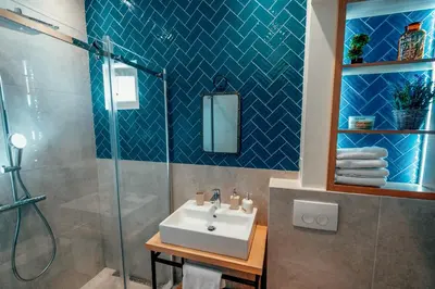 a bathroom with a sink and a shower at Miha Luxury Apartment in Belgrade