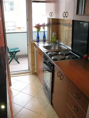 a kitchen with a sink and a stove top oven at Garden in Belgrade
