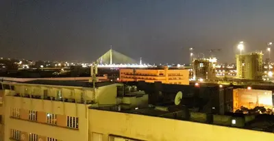 a view of a city at night with buildings at City centre penthouse in Belgrade