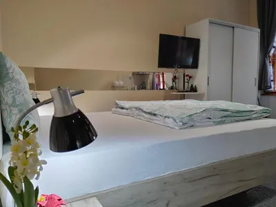 a bedroom with a bed with a lamp on it at Apartment Danijela-City Centar in Belgrade