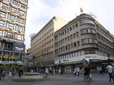 a busy city street with people walking in front of buildings at Apartment Danijela-City Centar in Belgrade