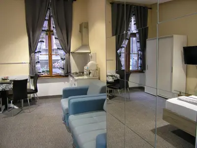 a room with a couch and a table and windows at Apartment Danijela-City Centar in Belgrade