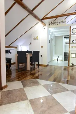 a living room with a checkered floor at Apartman Rustik in Belgrade