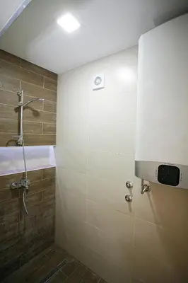 a bathroom with a shower and a sink at White Lux apartment in Belgrade