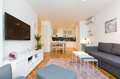 a living room with a couch and a table at Belgrade Center Apartment II in Belgrade