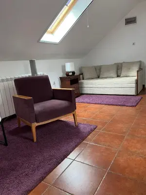 a living room with a couch and a chair at Apartment Dixy in Belgrade
