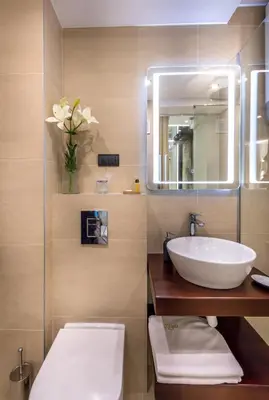 a bathroom with a white sink and a mirror at Onyx luxury apartments in Belgrade