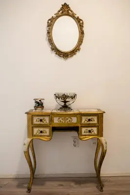 a dressing table with a mirror on a wall at Natalie's Apartment in Belgrade