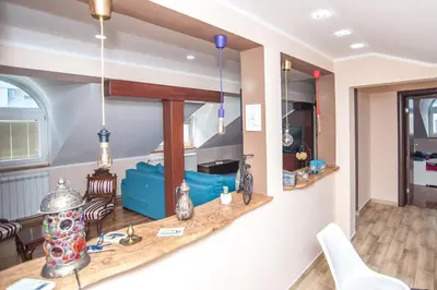 a room with a table and a mirror on the wall at Wizard House Belgrade in Belgrade