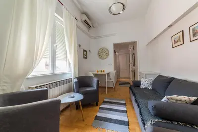 a living room with a couch and chairs and a table at Apartment Resavska in Belgrade